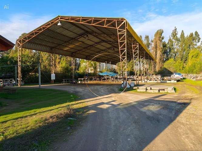 CASA CON GRAN TERRENO Y GALPÓN COMERCIAL