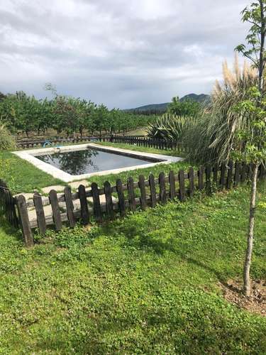 Terreno agrícola con derechos de agua, casa y piscina