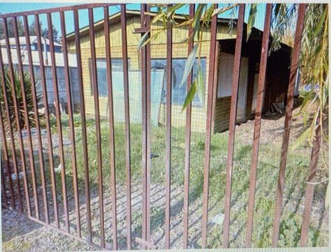amplio terreno con casa casi terminada centro pueblo hundido