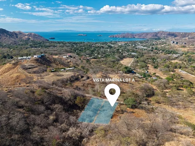 Vista Marina Lote A | Calle pavimentada, barrio residencial, con agua - Imagen 4