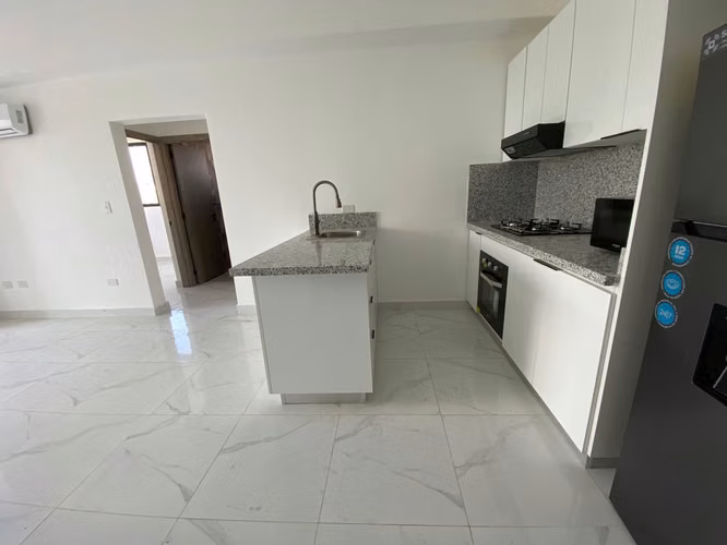 Apartamento de Inversión de 2 Habitaciones en Naco con Linea Blanca e Inquilino.