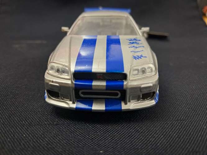 Juguete de rápidos y furiosos nissan skyline GT-R R34 escala 1/32 - Imagen 2
