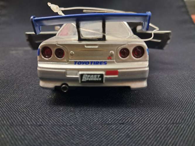 Juguete de rápidos y furiosos nissan skyline GT-R R34 escala 1/32 - Imagen 4