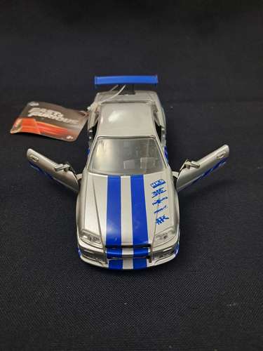 Juguete de rápidos y furiosos nissan skyline GT-R R34 escala 1/32