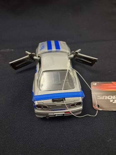 Juguete de rápidos y furiosos nissan skyline GT-R R34 escala 1/32 - Imagen 3