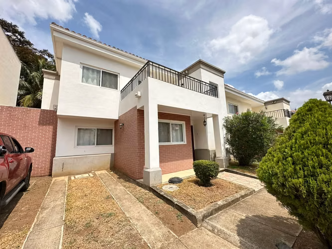condominium with communal pool house with furniture