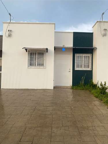 There's a house in the middle of the city. San Juan Opico